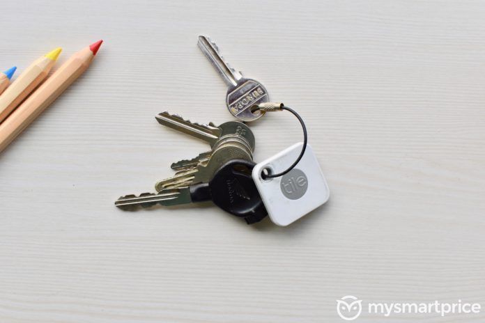 Tile Mate Bluetooth Tracker Attached To Keys Through Keychain Hole